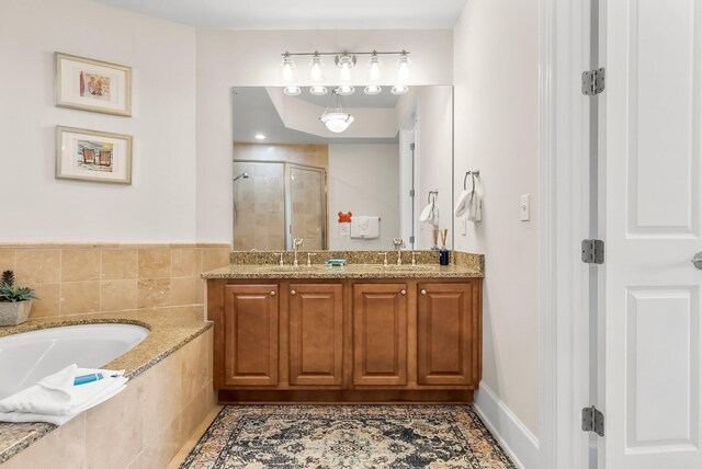 1653 W County Highway 30a Unit 1109, Santa Rosa Beach, FL 32459 - bathroom featuring a shower stall, a garden tub, and double vanity