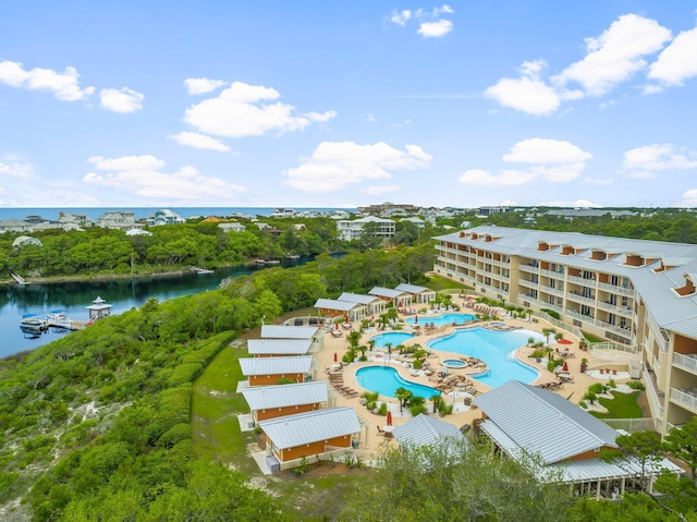 1653 W County Highway 30a Unit 1109, Santa Rosa Beach, FL 32459 - bird's eye view of a large body of water, a pool, and a tree filled landscape