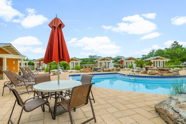 1653 W County Highway 30a Unit 1109, Santa Rosa Beach, FL 32459 - community pool featuring an outdoor structure and a patio