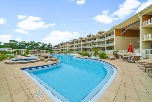 1653 W County Highway 30a Unit 1109, Santa Rosa Beach, FL 32459 - community pool featuring a community hot tub, a patio, and fence