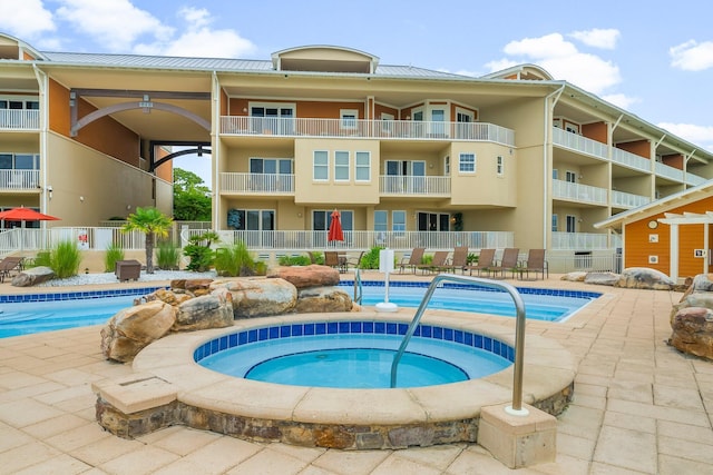 1653 W County Highway 30a Unit 1109, Santa Rosa Beach, FL 32459 - community pool featuring a community hot tub, fence, and a patio area
