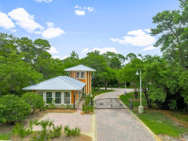 1653 W County Highway 30a Unit 1109, Santa Rosa Beach, FL 32459 - view of community featuring a gate, a fenced front yard, and decorative driveway