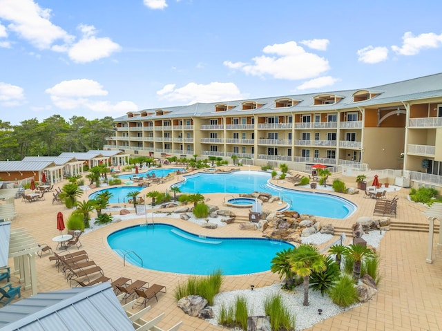 1653 W County Highway 30a Unit 1109, Santa Rosa Beach, FL 32459 - community pool with a community hot tub and a patio area
