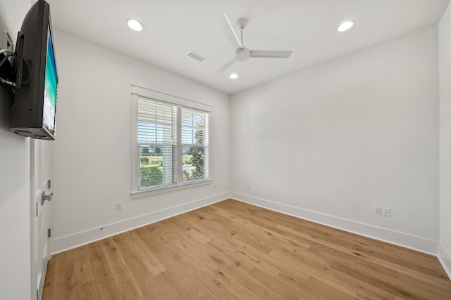 empty room with light wood finished floors, a ceiling fan, baseboards, and recessed lighting