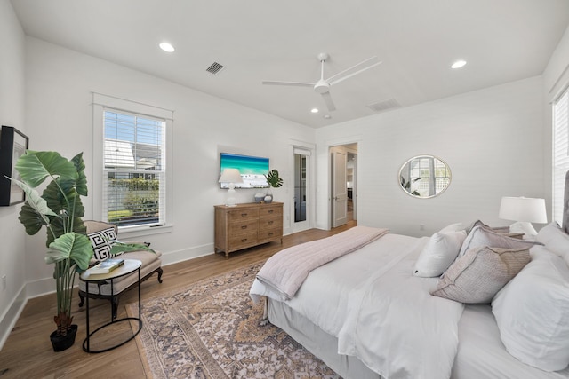 bedroom featuring wood finished floors, ceiling fan, recessed lighting, and baseboards