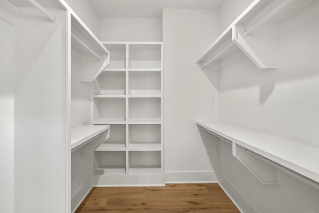 spacious closet with wood finished floors