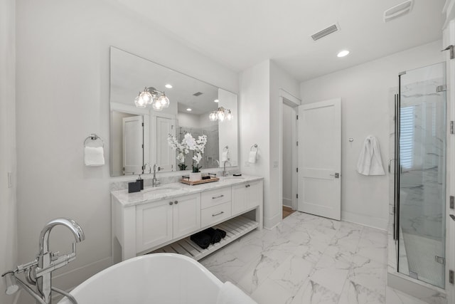 bathroom featuring a stall shower, recessed lighting, double vanity, a freestanding tub, and marble look tile flooring