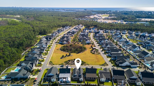 aerial perspective of suburban area featuring a forest