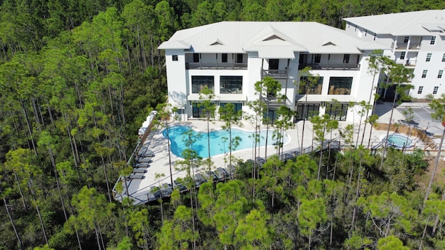 179 S County Highway 393 Unit 445, Santa Rosa Beach, FL 32459 - view of subject property featuring a pool area and a heavily wooded area