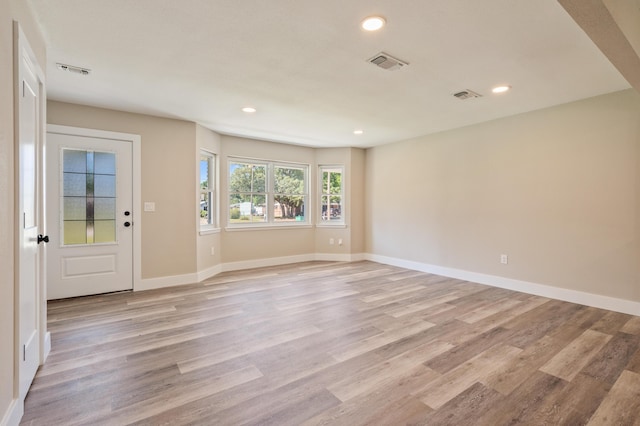 1411 28th St, Niceville, FL 32578 - spare room with light wood finished floors, recessed lighting, and baseboards