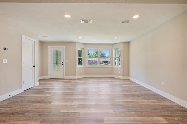 1411 28th St, Niceville, FL 32578 - empty room with wood finished floors, recessed lighting, and baseboards