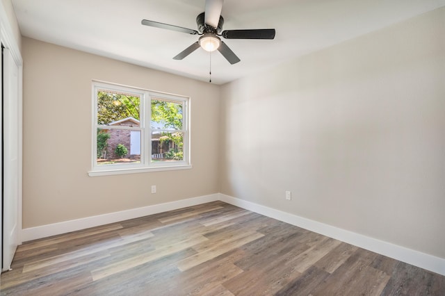 1411 28th St, Niceville, FL 32578 - empty room with wood finished floors, a ceiling fan, and baseboards