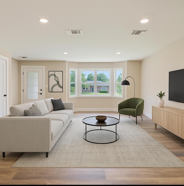 1411 28th St, Niceville, FL 32578 - living room featuring wood finished floors, recessed lighting, and baseboards