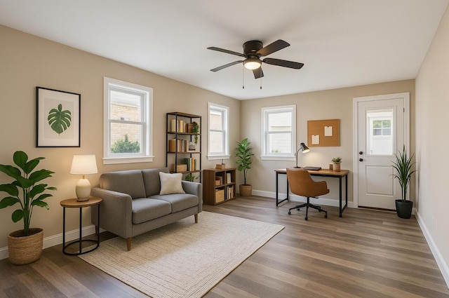 1411 28th St, Niceville, FL 32578 - office area featuring wood finished floors, a ceiling fan, and baseboards