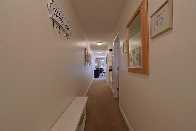 2606 Scenic Gulf Dr Unit 4108, Miramar Beach, FL 32550 - corridor featuring dark colored carpet and baseboards
