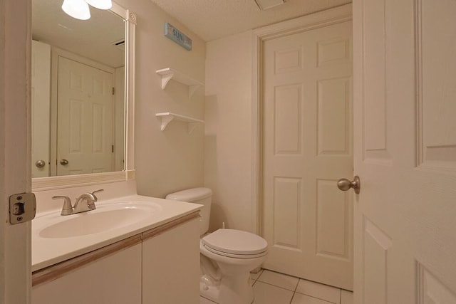 2606 Scenic Gulf Dr Unit 4108, Miramar Beach, FL 32550 - bathroom featuring tile patterned flooring, vanity, toilet, and a textured ceiling