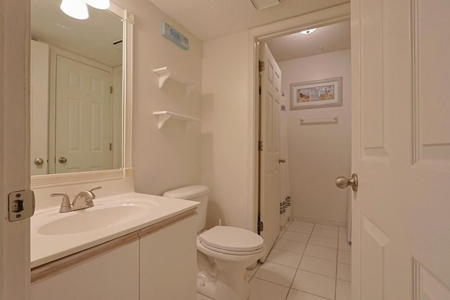 2606 Scenic Gulf Dr Unit 4108, Miramar Beach, FL 32550 - full bath featuring toilet, a textured ceiling, tile patterned floors, and vanity