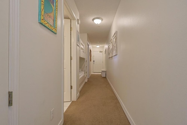 2606 Scenic Gulf Dr Unit 4108, Miramar Beach, FL 32550 - hallway featuring light colored carpet and baseboards