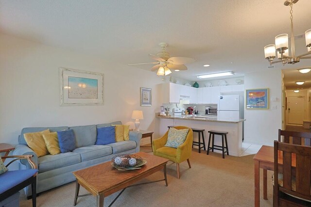 2606 Scenic Gulf Dr Unit 4108, Miramar Beach, FL 32550 - living area featuring a ceiling fan, light carpet, and a chandelier