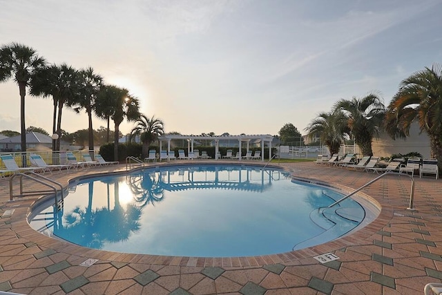 2606 Scenic Gulf Dr Unit 4108, Miramar Beach, FL 32550 - pool at dusk with a community pool and a patio