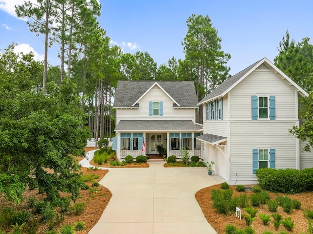 728 Breakers St, Watersound, FL 32461 - view of front of home featuring covered porch, driveway, and a shingled roof