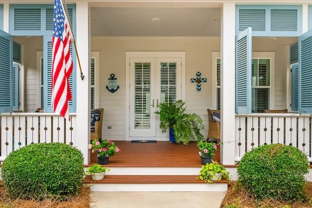 728 Breakers St, Watersound, FL 32461 - doorway to property featuring a porch, french doors, and concrete driveway