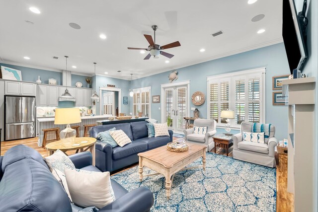 728 Breakers St, Watersound, FL 32461 - living room with light wood-type flooring, a ceiling fan, recessed lighting, and ornamental molding