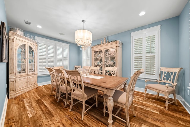 728 Breakers St, Watersound, FL 32461 - dining room featuring wood finished floors, a chandelier, baseboards, and recessed lighting