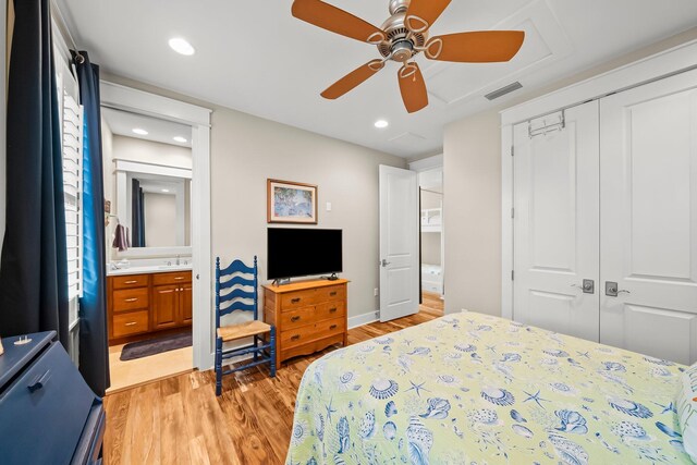 728 Breakers St, Watersound, FL 32461 - bedroom with light wood finished floors, a closet, ensuite bath, a ceiling fan, and recessed lighting