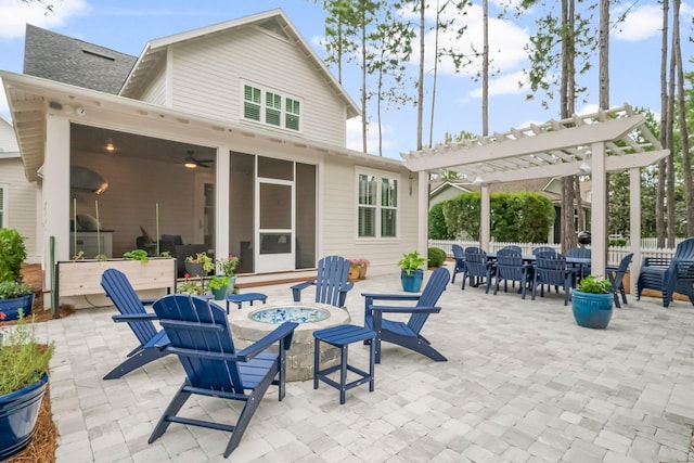 728 Breakers St, Watersound, FL 32461 - view of patio featuring an outdoor fire pit, a pergola, a sunroom, and outdoor dining space