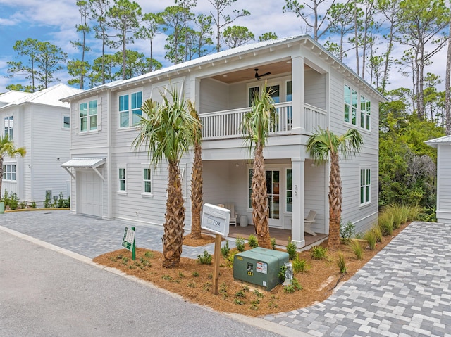 26 Silver Maple Dr, Inlet Beach, FL 32461 - view of front of home with a balcony, a garage, and decorative driveway