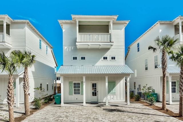 246 Driftwood Rd, Miramar Beach, FL 32550 - back of property featuring a balcony, board and batten siding, and metal roof