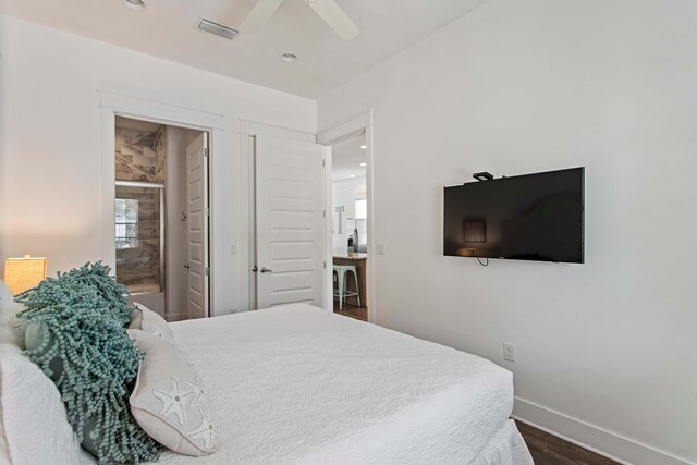 246 Driftwood Rd, Miramar Beach, FL 32550 - bedroom with baseboards, dark wood finished floors, recessed lighting, ceiling fan, and ensuite bath