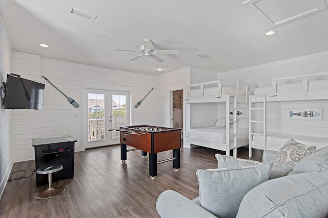 246 Driftwood Rd, Miramar Beach, FL 32550 - game room featuring a ceiling fan, dark wood-type flooring, french doors, wooden walls, and ornamental molding