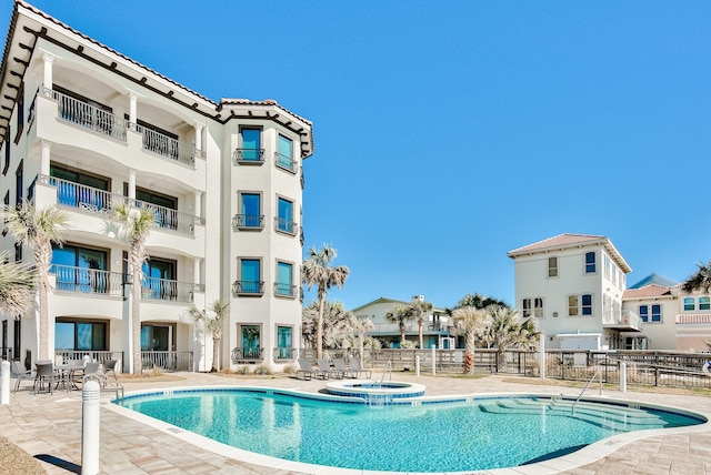 134 Norwood Dr Ph 3, Miramar Beach, FL 32550 - community pool with fence, a community hot tub, and a patio