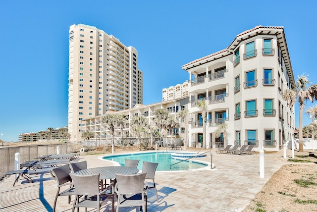 134 Norwood Dr Ph 3, Miramar Beach, FL 32550 - community pool featuring a patio area and fence