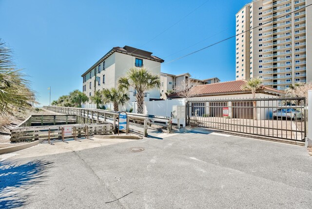 134 Norwood Dr Ph 3, Miramar Beach, FL 32550 - view of building exterior featuring fence