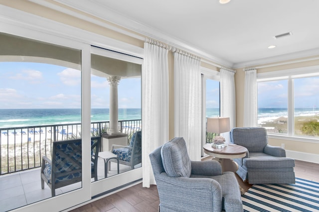 134 Norwood Dr Ph 3, Miramar Beach, FL 32550 - sitting room featuring view of water and beach, ornamental molding, wood finished floors, recessed lighting, and baseboards