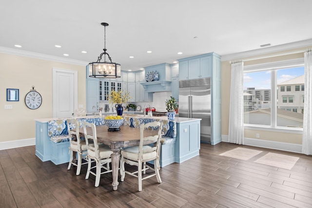134 Norwood Dr Ph 3, Miramar Beach, FL 32550 - dining space featuring baseboards, a chandelier, dark wood finished floors, ornamental molding, and recessed lighting