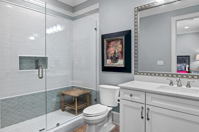 134 Norwood Dr Ph 3, Miramar Beach, FL 32550 - bathroom with a stall shower, toilet, wood finished floors, vanity, and ornamental molding