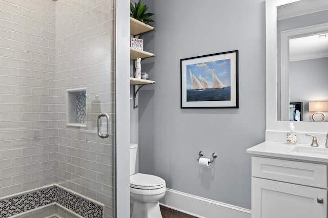 134 Norwood Dr Ph 3, Miramar Beach, FL 32550 - bathroom with a stall shower, toilet, vanity, baseboards, and ornamental molding