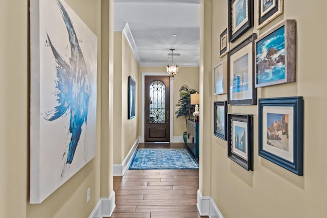 134 Norwood Dr Ph 3, Miramar Beach, FL 32550 - foyer entrance featuring ornamental molding, wood finished floors, and baseboards