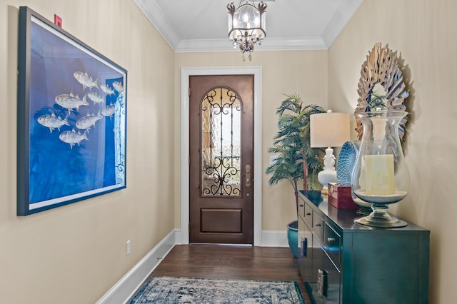 134 Norwood Dr Ph 3, Miramar Beach, FL 32550 - entrance foyer with dark wood-type flooring, baseboards, crown molding, and a chandelier