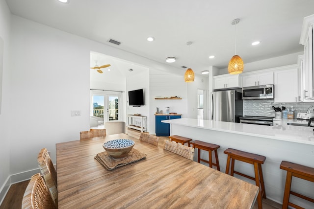 216 E Park Place Ave, Inlet Beach, FL 32461 - dining area with dark wood finished floors, recessed lighting, and french doors