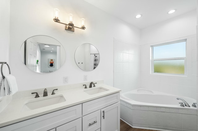 216 E Park Place Ave, Inlet Beach, FL 32461 - full bath featuring a garden tub, double vanity, wood finished floors, and recessed lighting