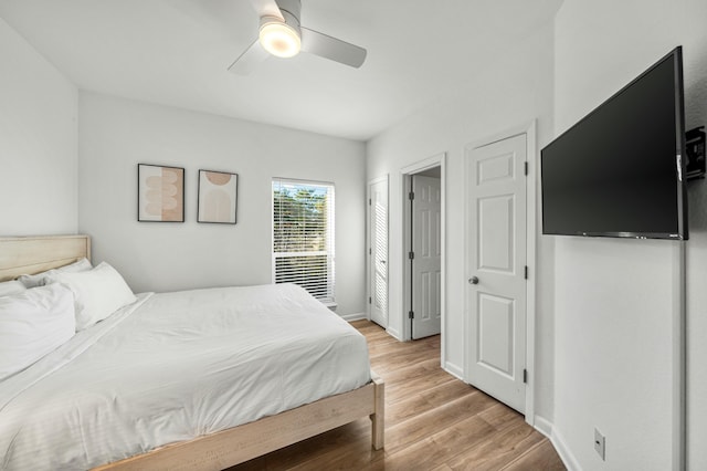 216 E Park Place Ave, Inlet Beach, FL 32461 - bedroom featuring light wood-style flooring, ceiling fan, and baseboards