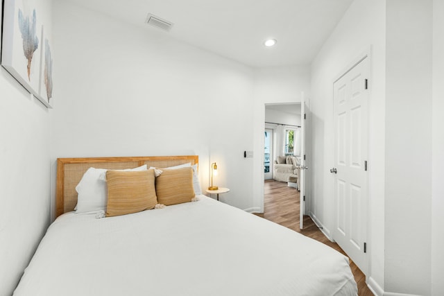 216 E Park Place Ave, Inlet Beach, FL 32461 - bedroom with dark wood finished floors, baseboards, recessed lighting, and a closet
