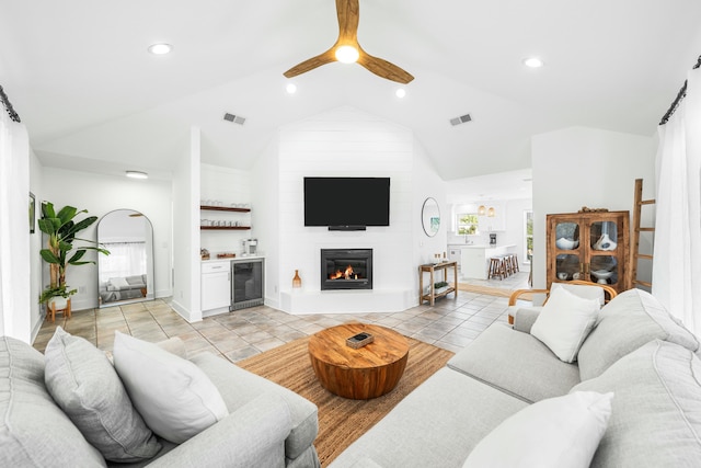 216 E Park Place Ave, Inlet Beach, FL 32461 - living room featuring wine cooler, lofted ceiling, ceiling fan, healthy amount of natural light, and a large fireplace