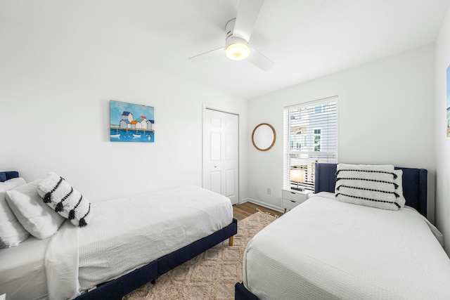 216 E Park Place Ave, Inlet Beach, FL 32461 - bedroom featuring wood finished floors, a closet, ceiling fan, and baseboards