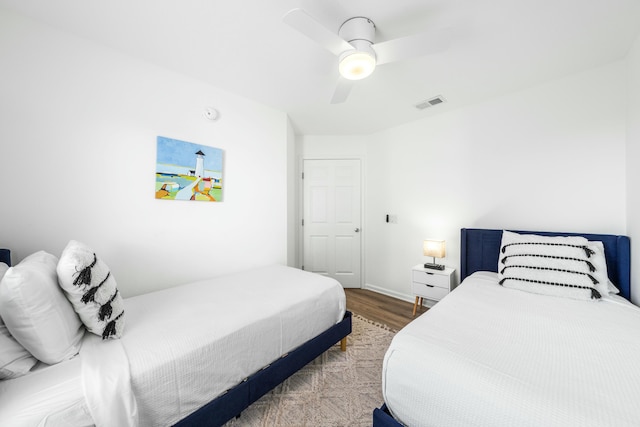 216 E Park Place Ave, Inlet Beach, FL 32461 - bedroom with wood finished floors, a ceiling fan, and baseboards